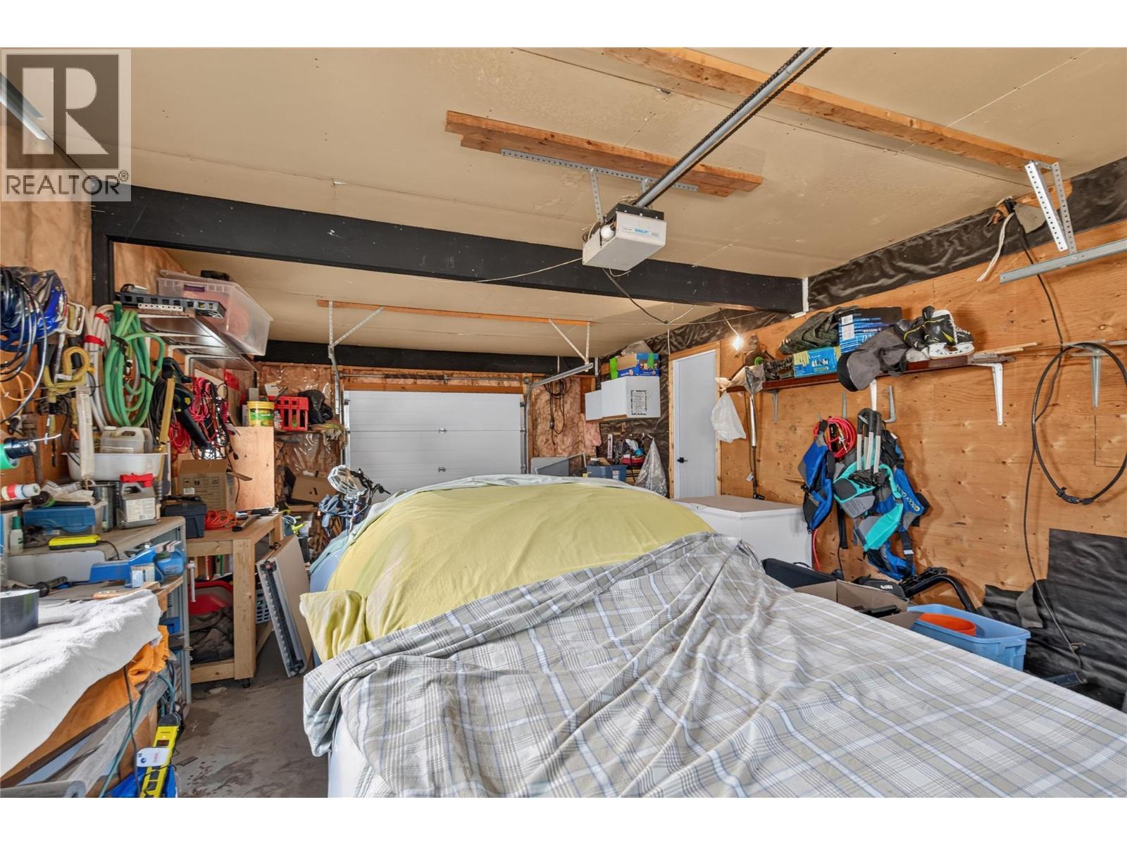 Garage - 6415 Glendora Way, Coldstream, BC - Indoor Photo Showing Garage