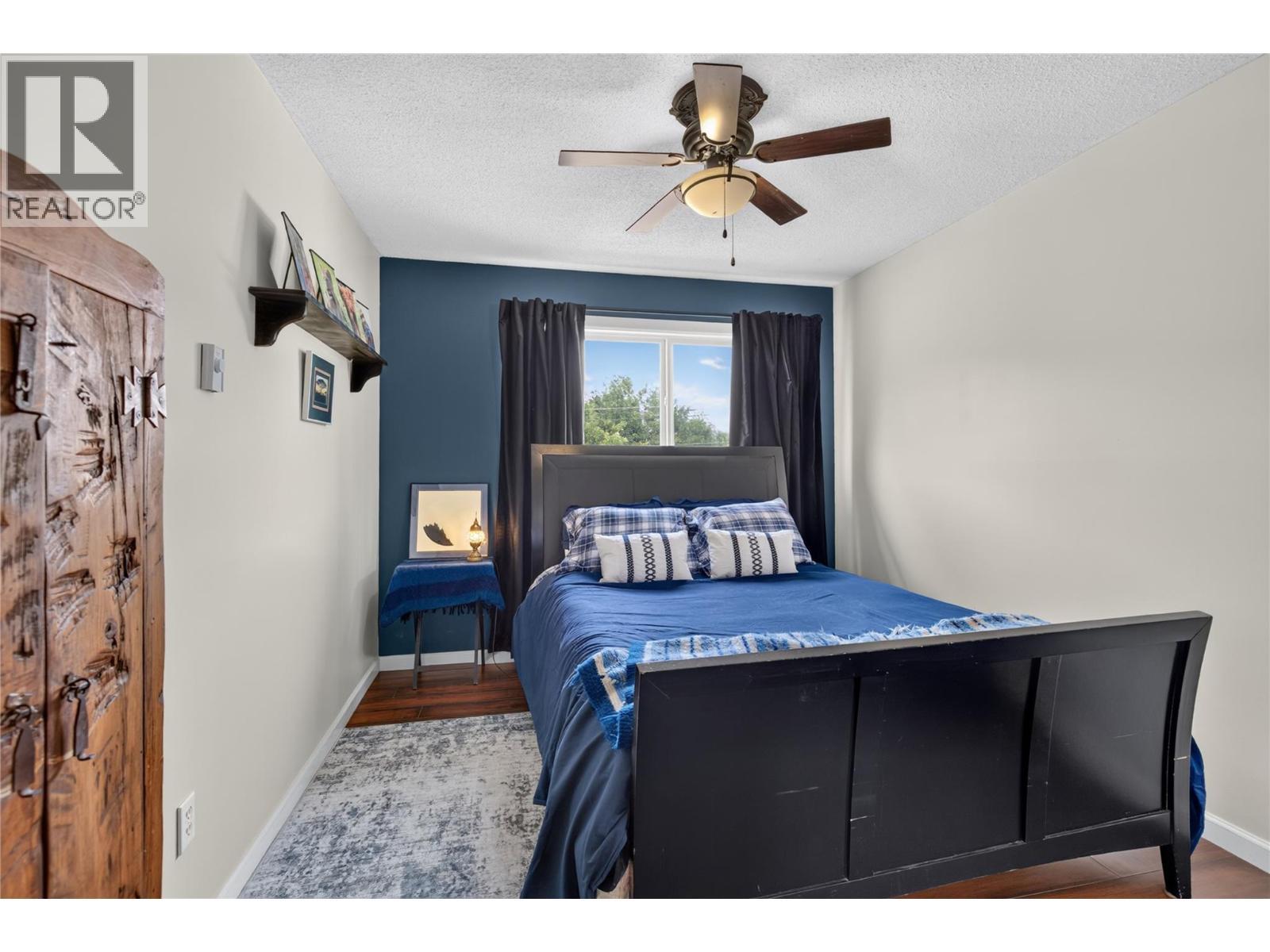 Upper Floor Bedroom - 6415 Glendora Way, Coldstream, BC - Indoor Photo Showing Bedroom