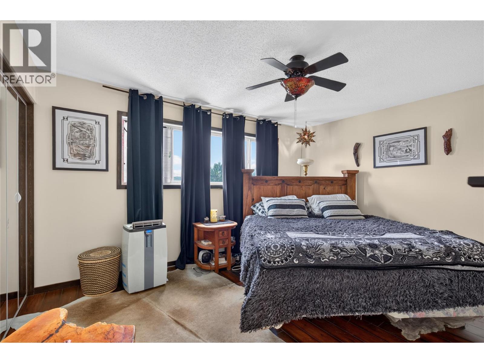 Primary Bedroom - 6415 Glendora Way, Coldstream, BC - Indoor Photo Showing Bedroom