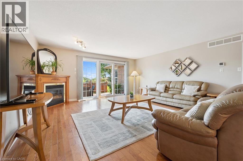 Living area featuring hardwood flooring. - 187 Westchester Drive, Kitchener, ON - Indoor Photo Showing Living Room With Fireplace