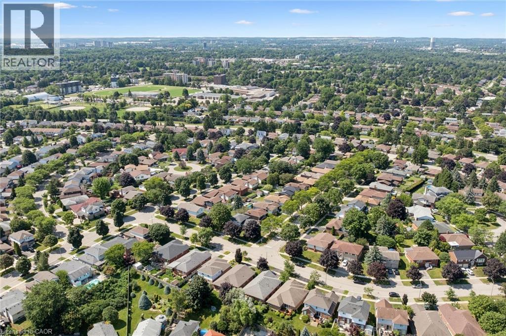 Expansive residential area featuring numerous detached homes with diverse architectural styles, abundant mature trees, and paved streets - 187 Westchester Drive, Kitchener, ON - Outdoor With View