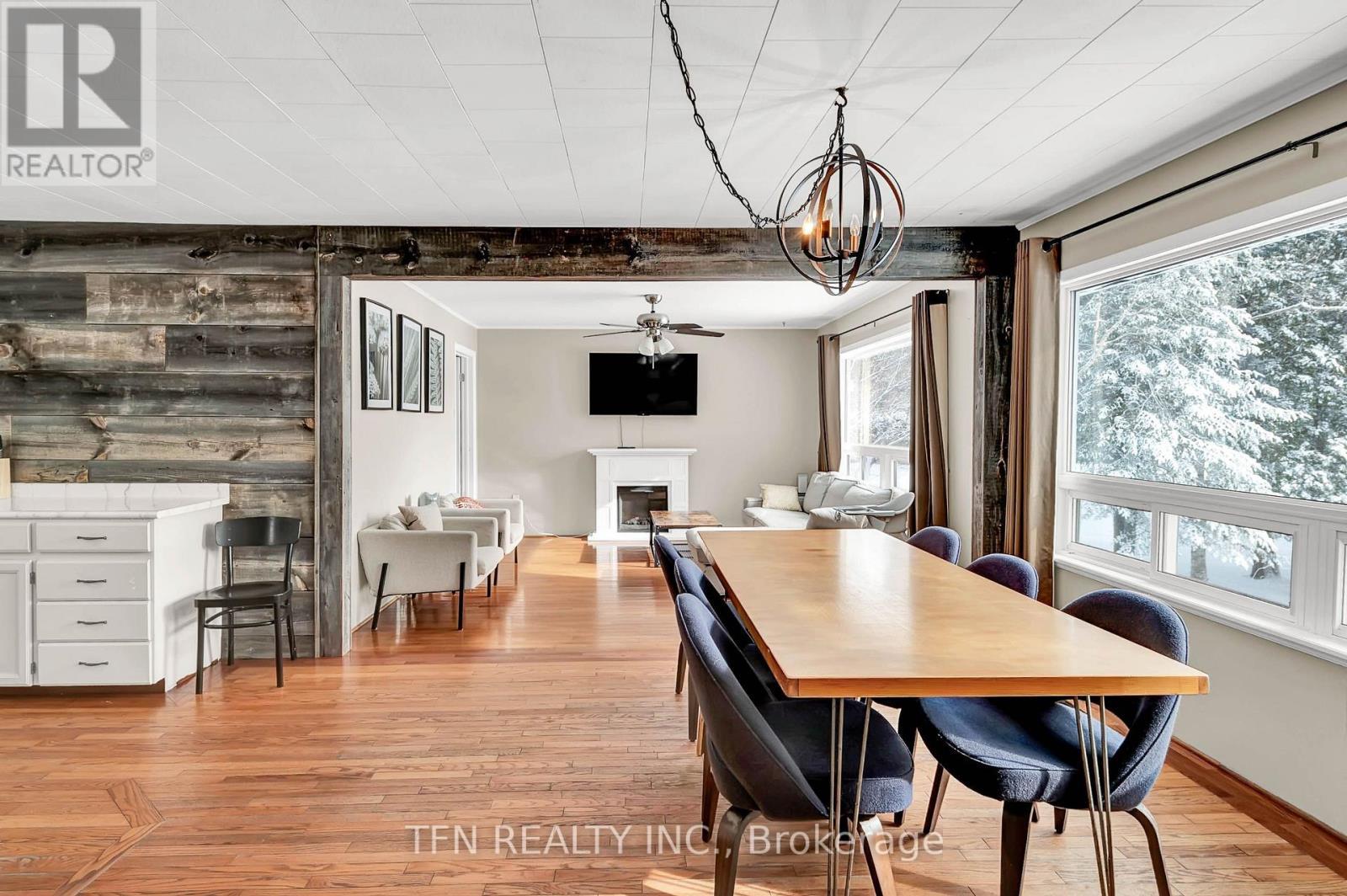 322 Concession Road W, Tiny, ON - Indoor Photo Showing Dining Room With Fireplace