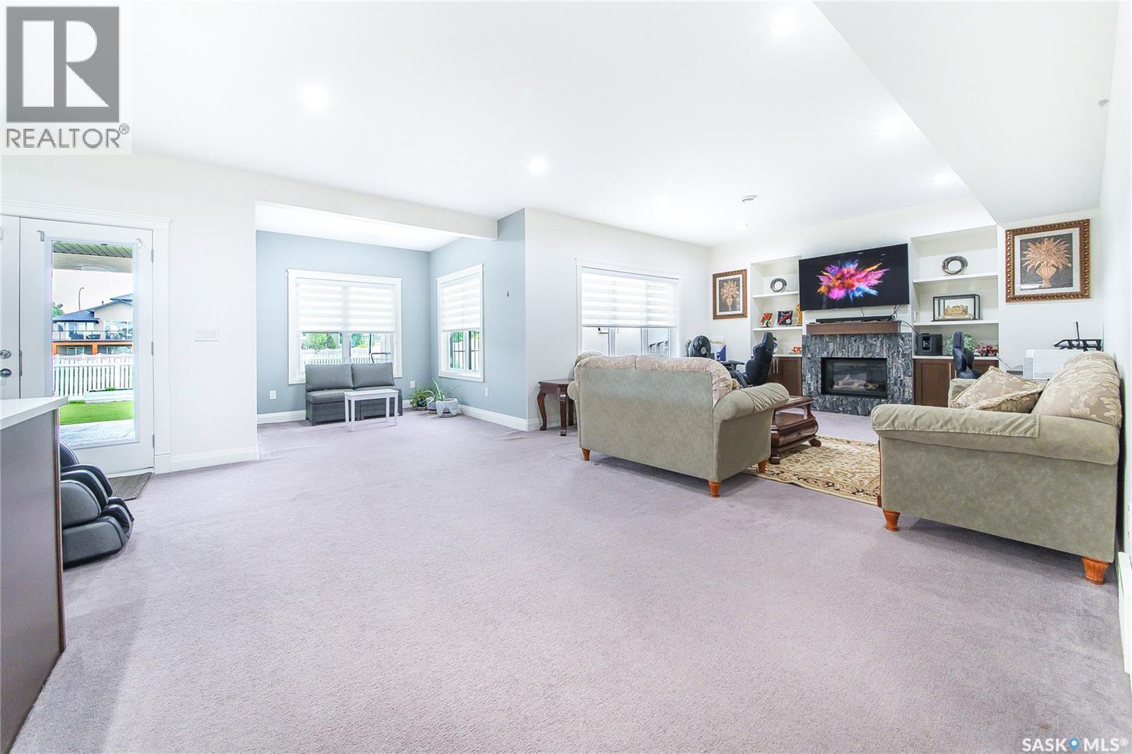 733 Gowan Road, Warman, SK - Indoor Photo Showing Living Room With Fireplace