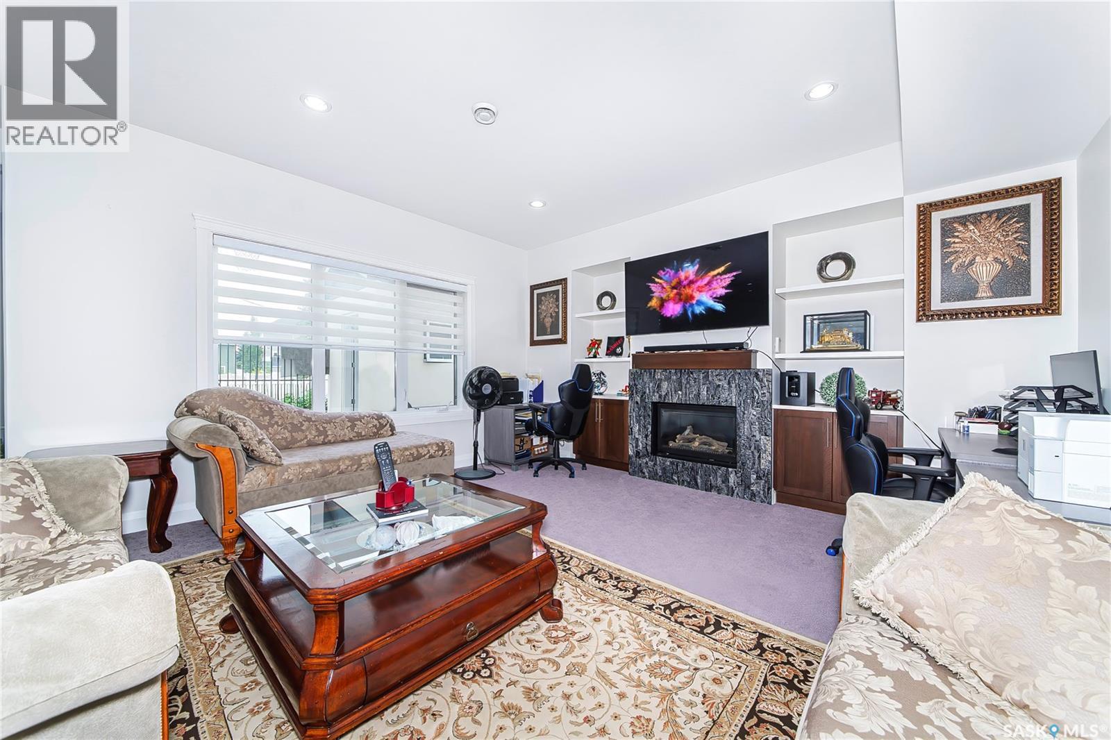 733 Gowan Road, Warman, SK - Indoor Photo Showing Living Room With Fireplace