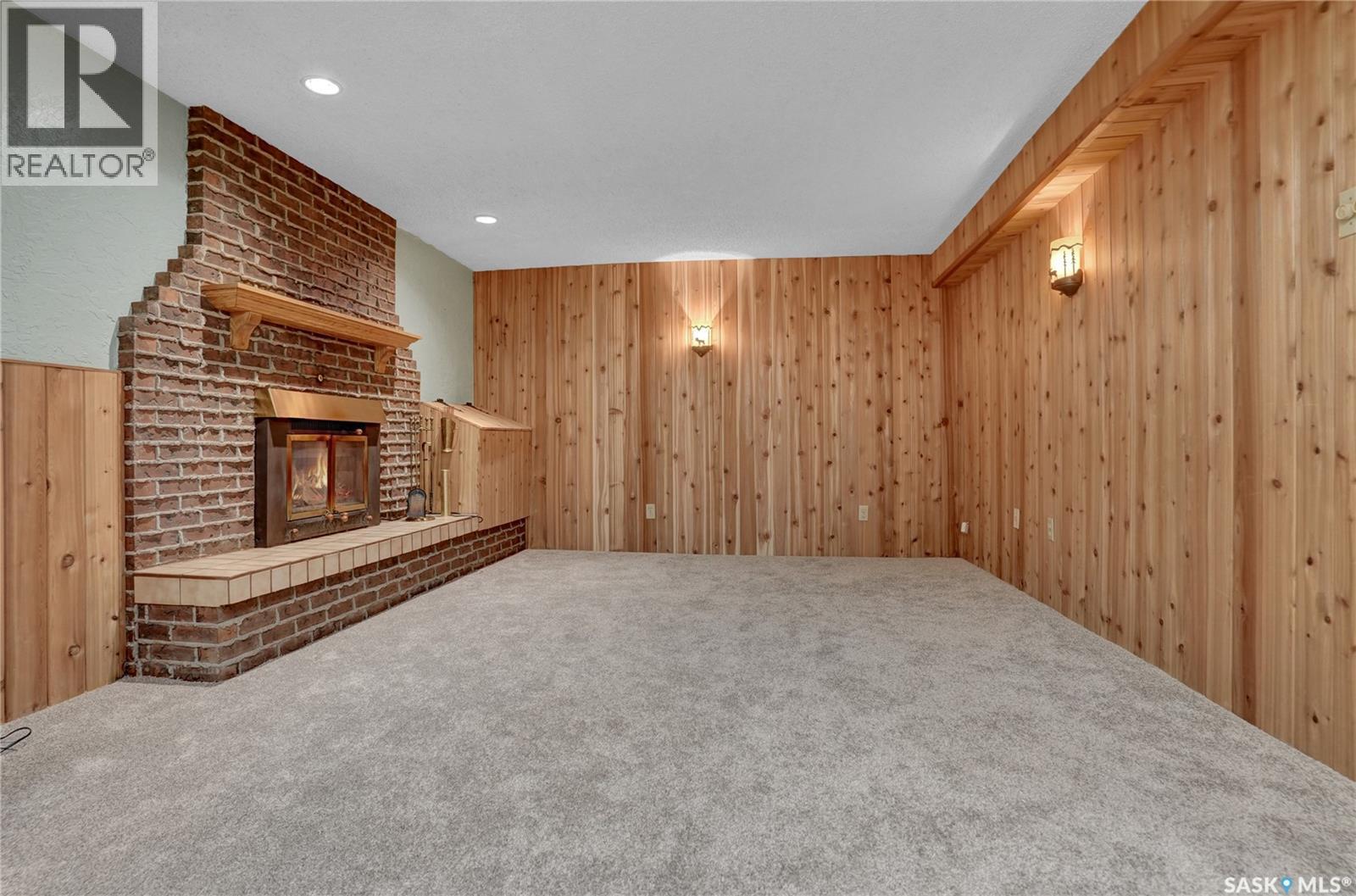 6015 7Th Avenue N, Regina, SK - Indoor Photo Showing Other Room With Fireplace