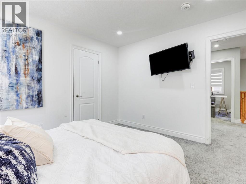 White-painted interior with light gray carpet flooring - 584 Pinery Trail, Waterloo, ON - Indoor Photo Showing Bedroom