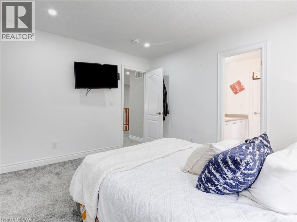 Plush gray carpeting throughout the room - 584 Pinery Trail, Waterloo, ON - Indoor Photo Showing Bedroom