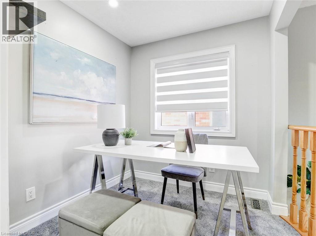 Dedicated office space featuring a single window with horizontal blinds, light gray wall paint, and gray carpeting - 584 Pinery Trail, Waterloo, ON - Indoor Photo Showing Office