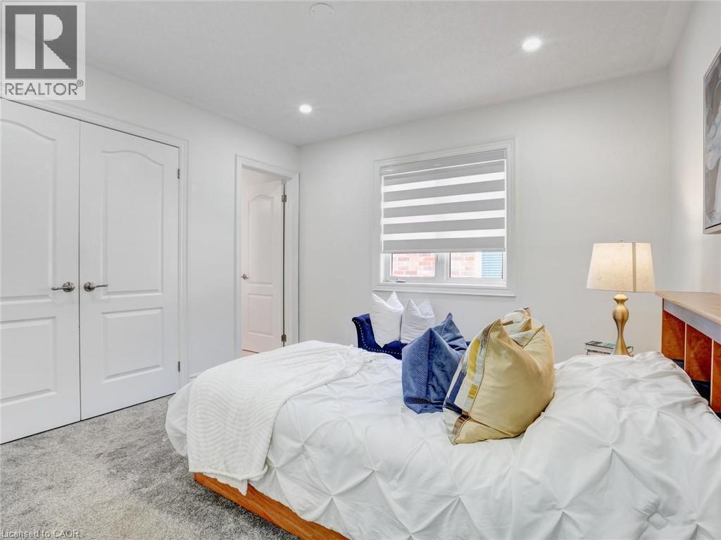 Bedroom with recessed lighting, white walls, and light-toned carpet flooring - 584 Pinery Trail, Waterloo, ON - Indoor Photo Showing Bedroom