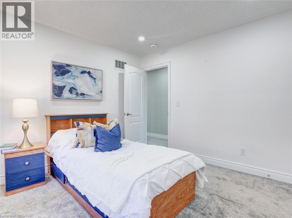 Light-colored walls with recessed lighting - 584 Pinery Trail, Waterloo, ON - Indoor Photo Showing Bedroom