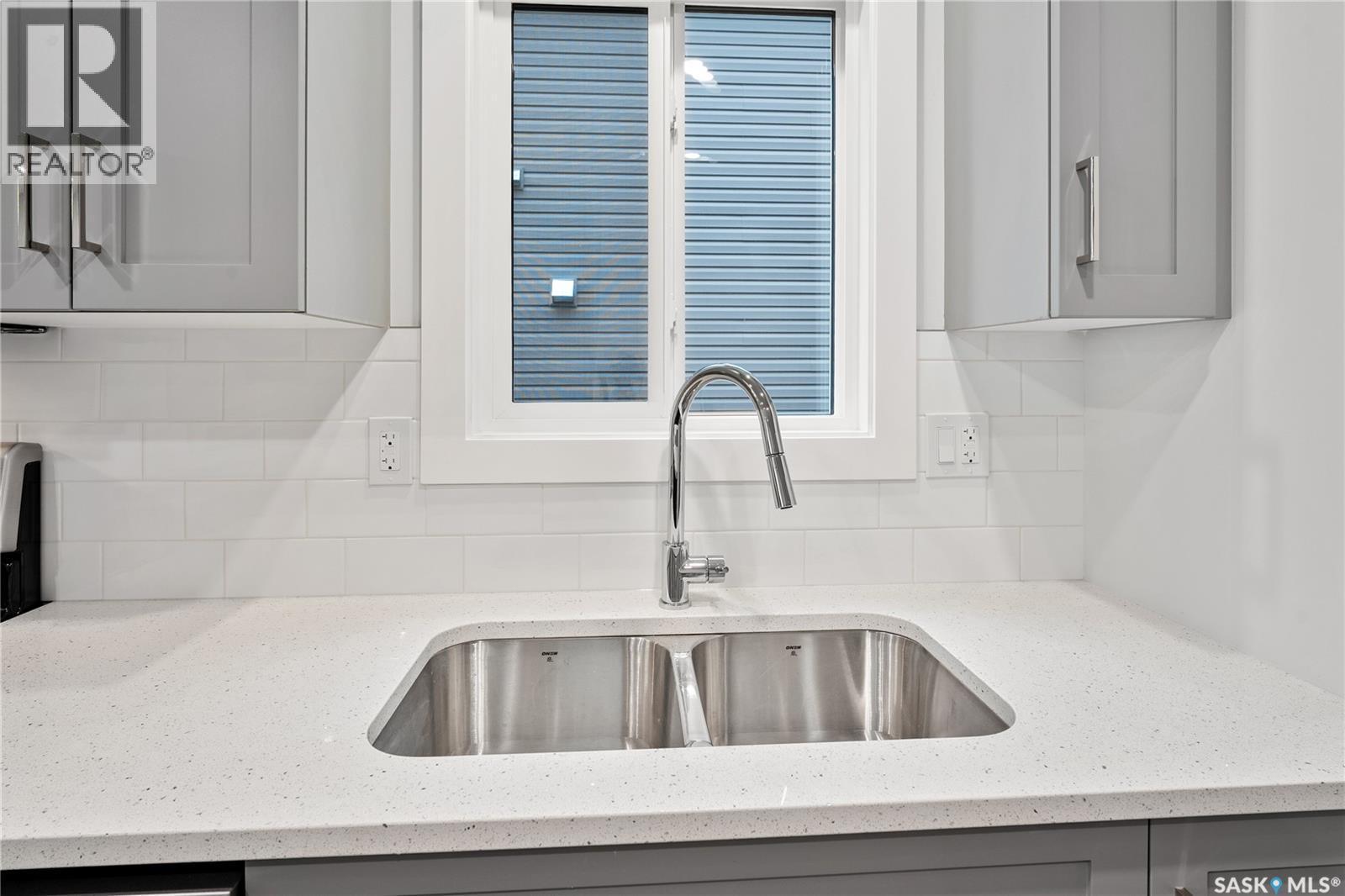 2921 Green Turtle Road, Regina, SK - Indoor Photo Showing Kitchen With Double Sink