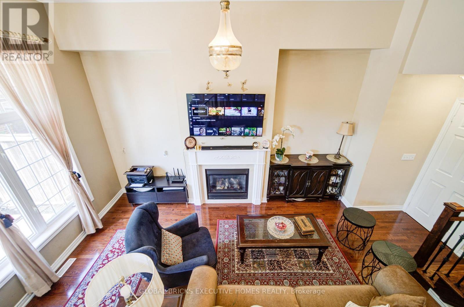 family room - 3885 Eglinton Avenue, Mississauga, ON - Indoor Photo Showing Living Room With Fireplace