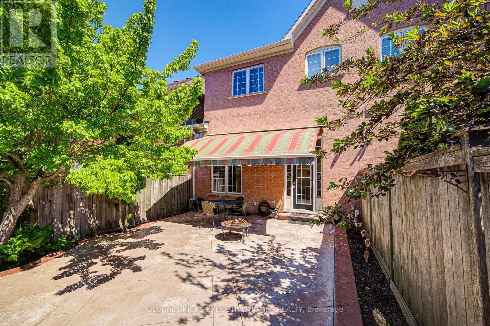 backyard with awning - 3885 Eglinton Avenue, Mississauga, ON - Outdoor With Deck Patio Veranda
