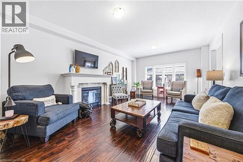 32 Dulgaren Street, Hamilton, ON - Indoor Photo Showing Living Room With Fireplace
