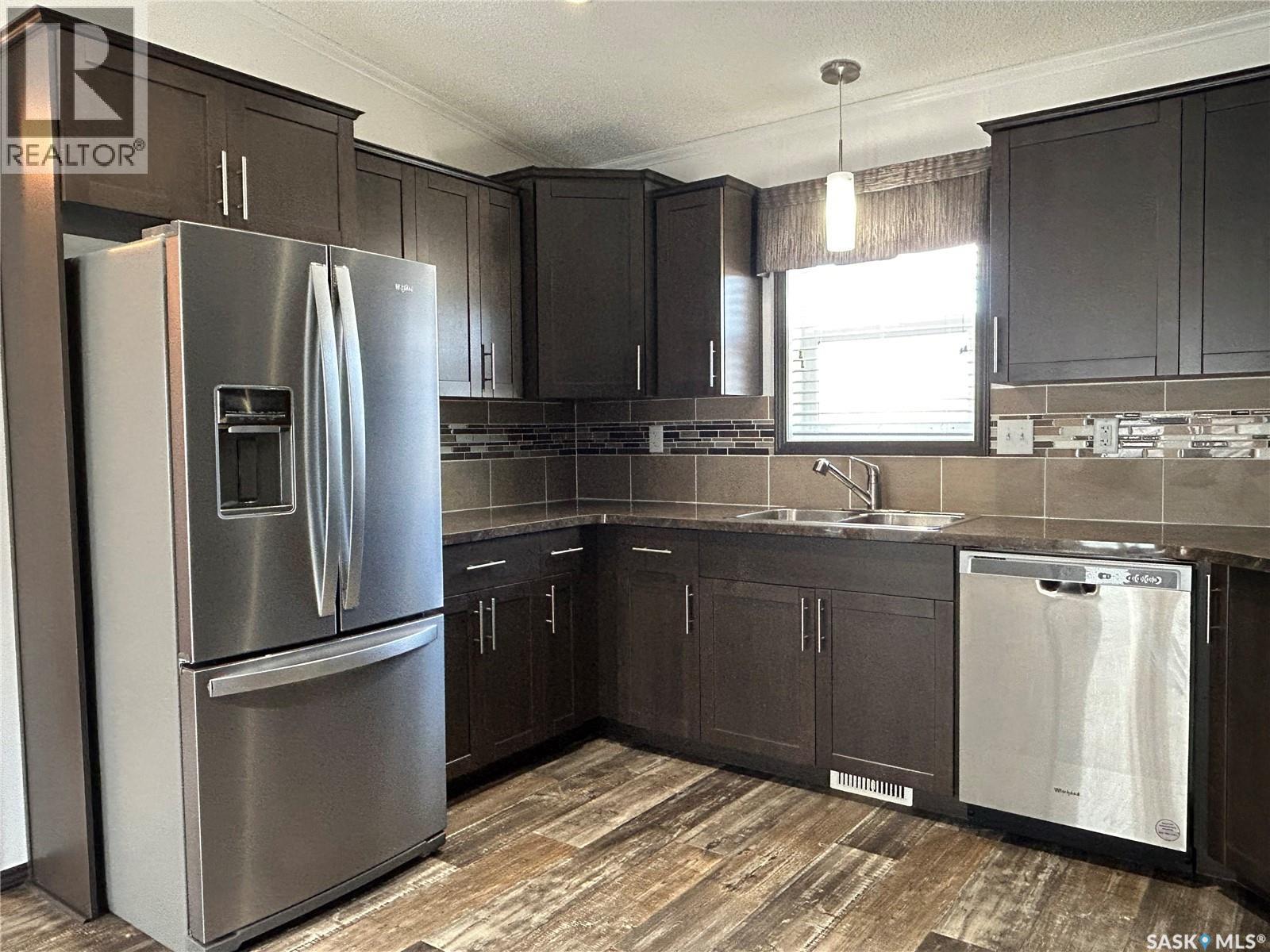 7 2004 Alice Road, Estevan, SK - Indoor Photo Showing Kitchen With Stainless Steel Kitchen With Double Sink