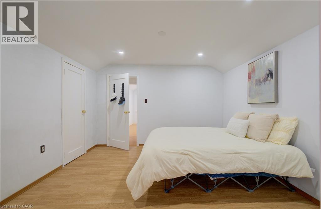 Room featuring wood-finish flooring, recessed lighting, and white baseboards - 182 Avalon Place, Kitchener, ON - Indoor Photo Showing Bedroom