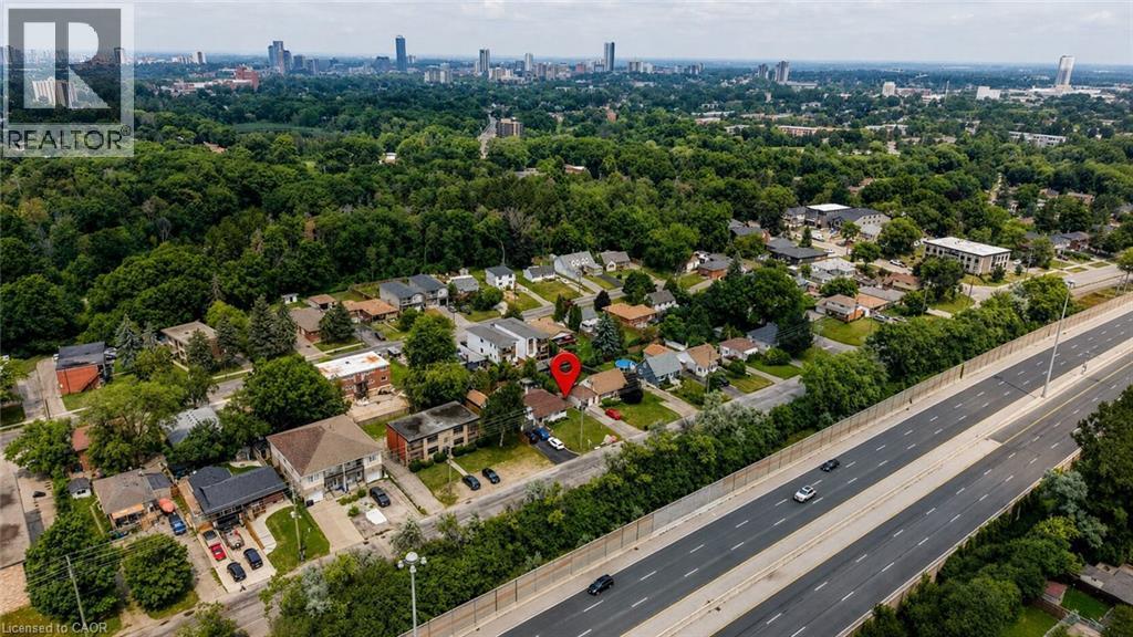 Aerial perspective showcasing the property within a residential area with mature tree coverage - 182 Avalon Place, Kitchener, ON - Outdoor With View