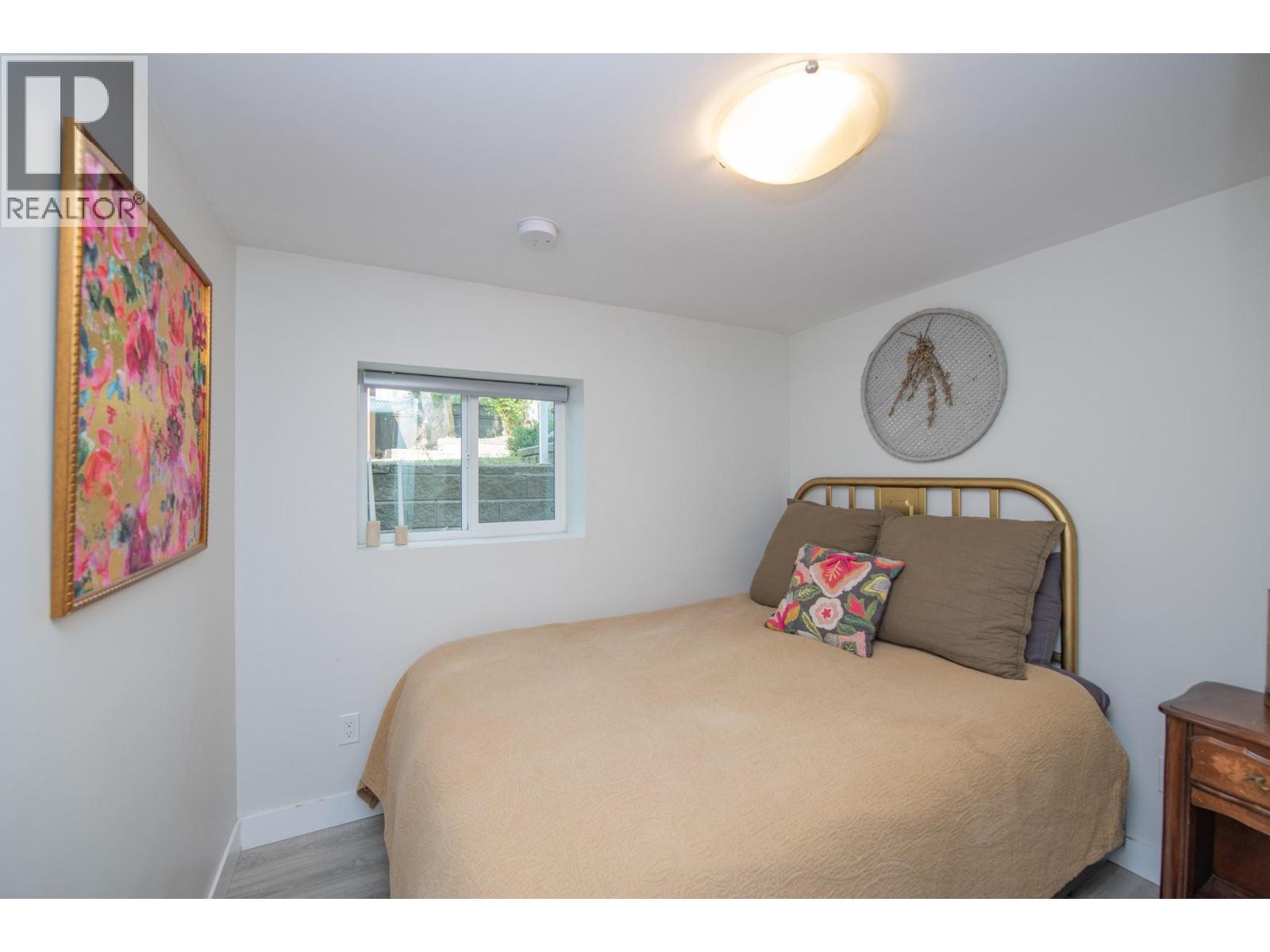 Basement Bedroom - 9211 6 Highway, Coldstream, BC - Indoor Photo Showing Bedroom