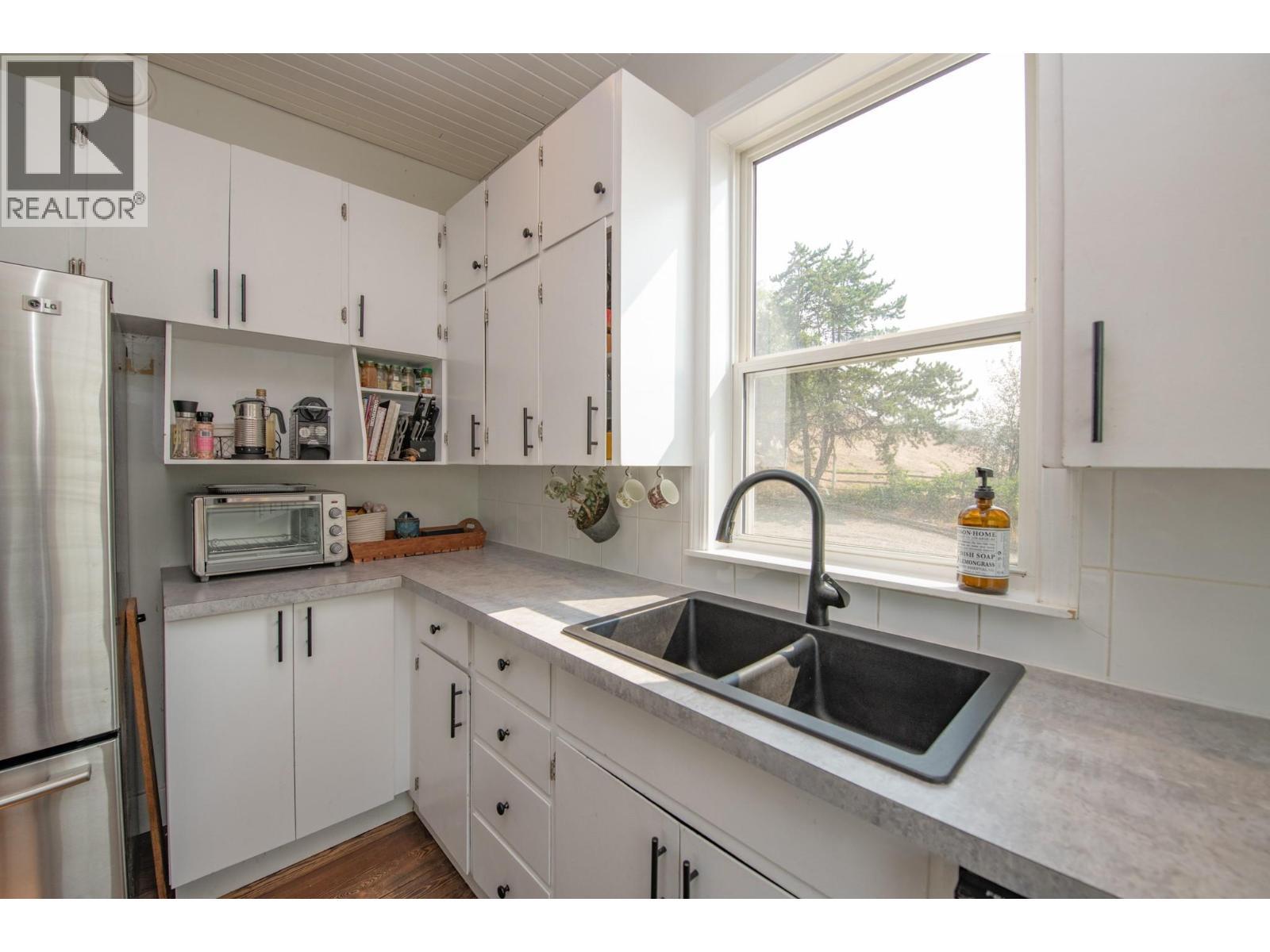 9211 6 Highway, Coldstream, BC - Indoor Photo Showing Kitchen With Double Sink
