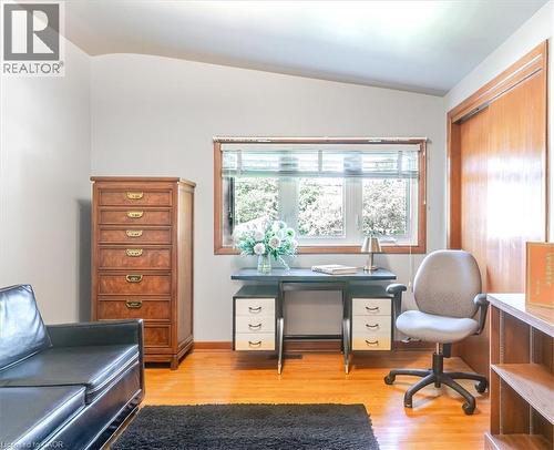 Bright room featuring wood-finish flooring and a large window with horizontal blinds - 69 Pleasant Avenue, Hamilton, ON - Indoor Photo Showing Office
