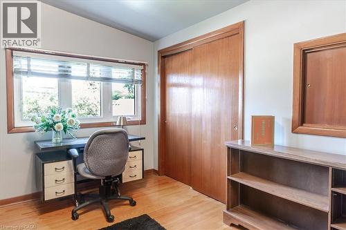 Hardwood-finish flooring complementing light-toned walls - 69 Pleasant Avenue, Hamilton, ON - Indoor Photo Showing Office