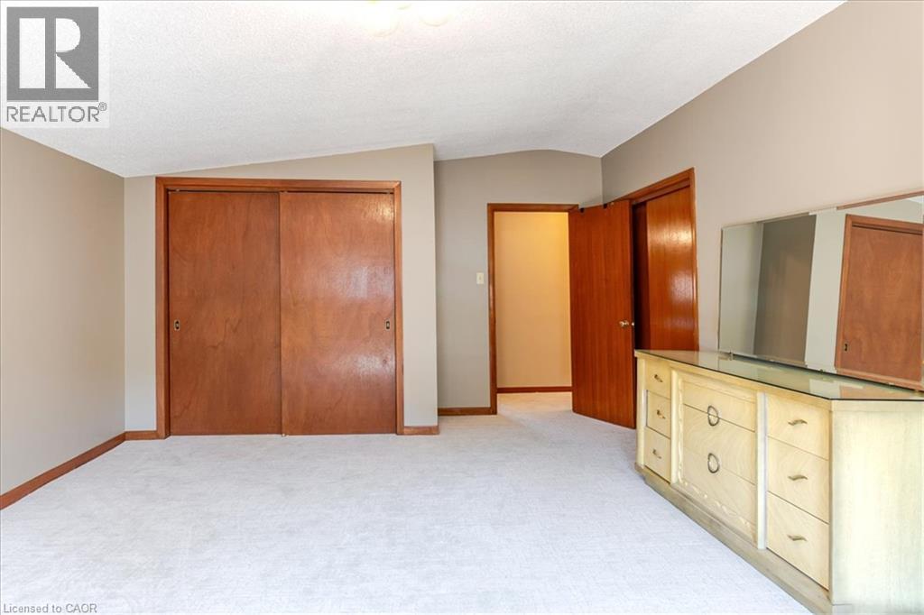 His and hers closets - 69 Pleasant Avenue, Hamilton, ON - Indoor Photo Showing Other Room