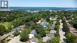 Expansive aerial perspective showcasing a residential neighborhood with verdant tree canopies - 