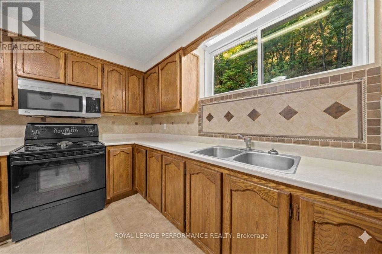 Basement - Virtually Decluttered - 1702 Russell Road, Ottawa, ON - Indoor Photo Showing Kitchen With Double Sink