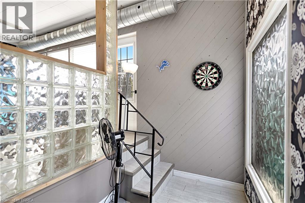 Glass block wall with a wood frame, complementing the wood-finish flooring - 371 Ottawa Street S, Kitchener, ON - Indoor