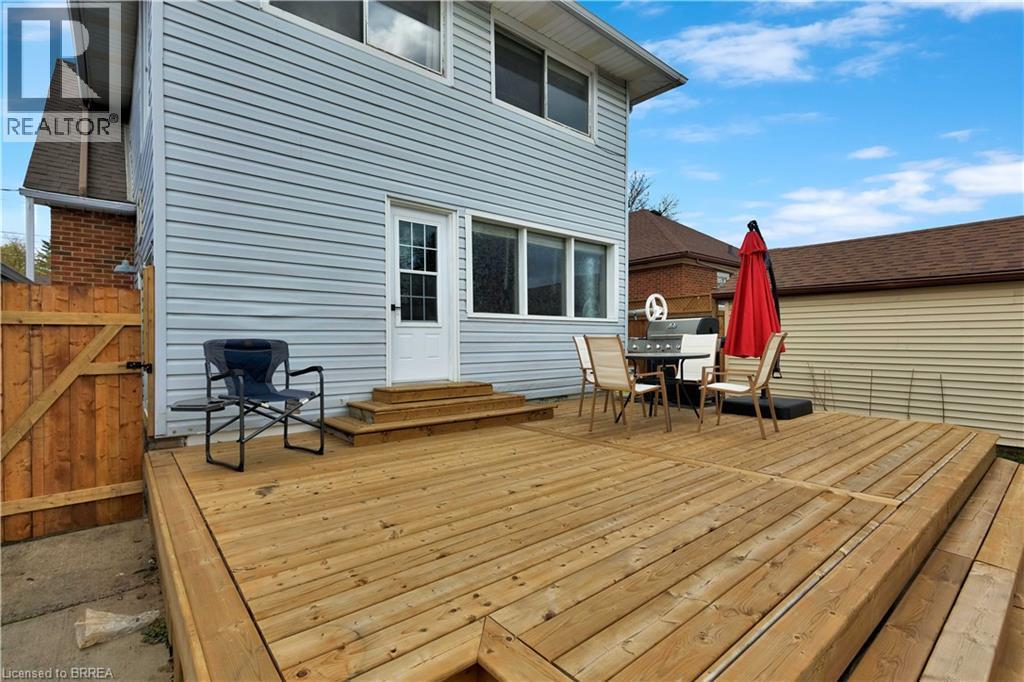 Expansive wood deck with multi-level design and direct access to the interior - 371 Ottawa Street S, Kitchener, ON - Outdoor With In Ground Pool