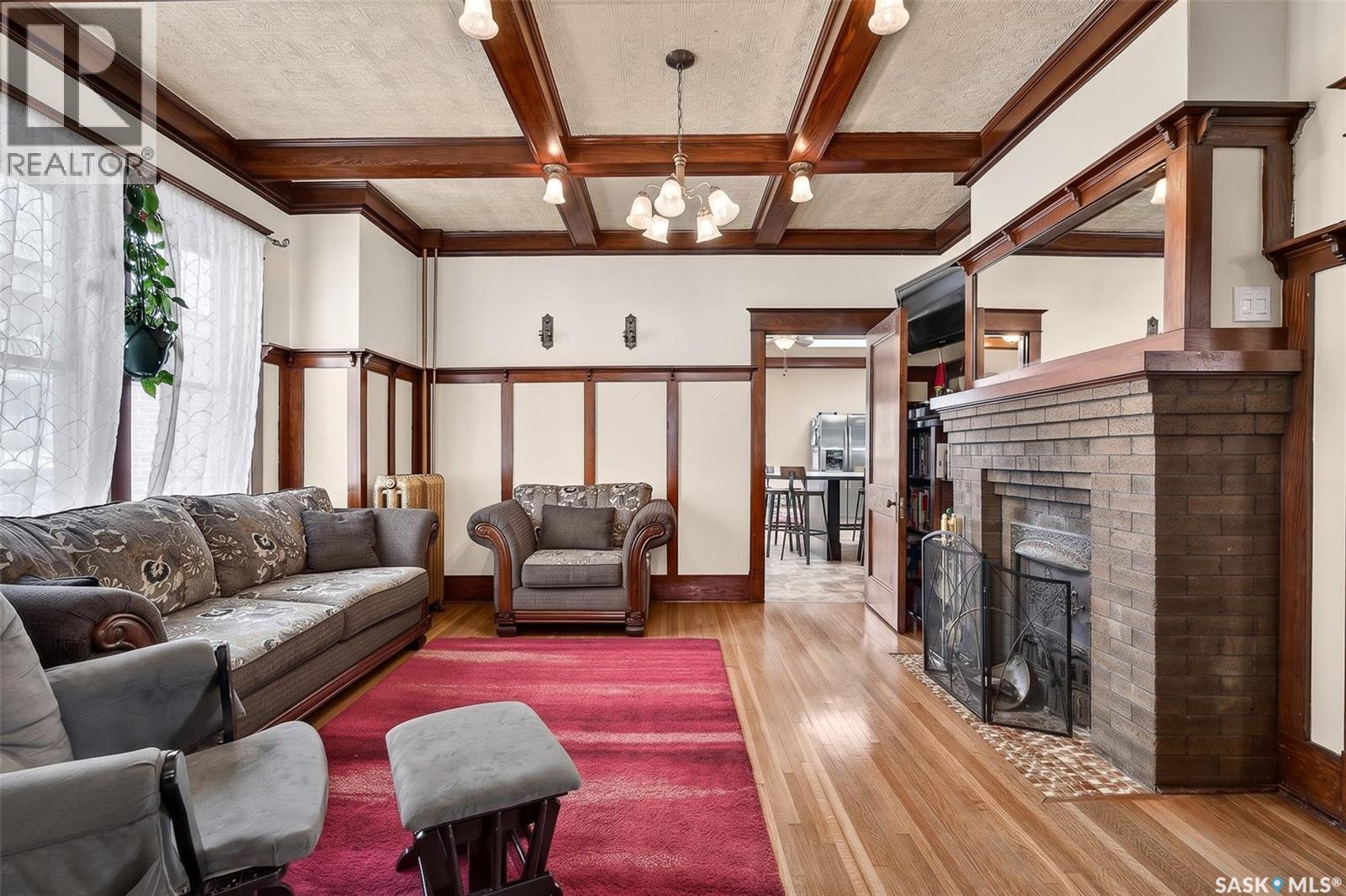 1037 Chestnut Avenue, Moose Jaw, SK - Indoor Photo Showing Living Room With Fireplace