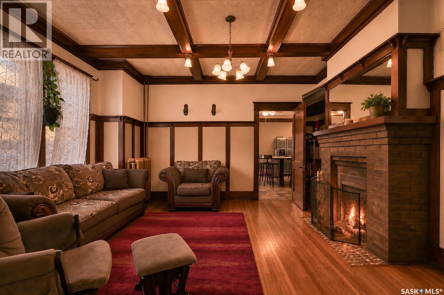 1037 Chestnut Avenue, Moose Jaw, SK - Indoor Photo Showing Living Room With Fireplace