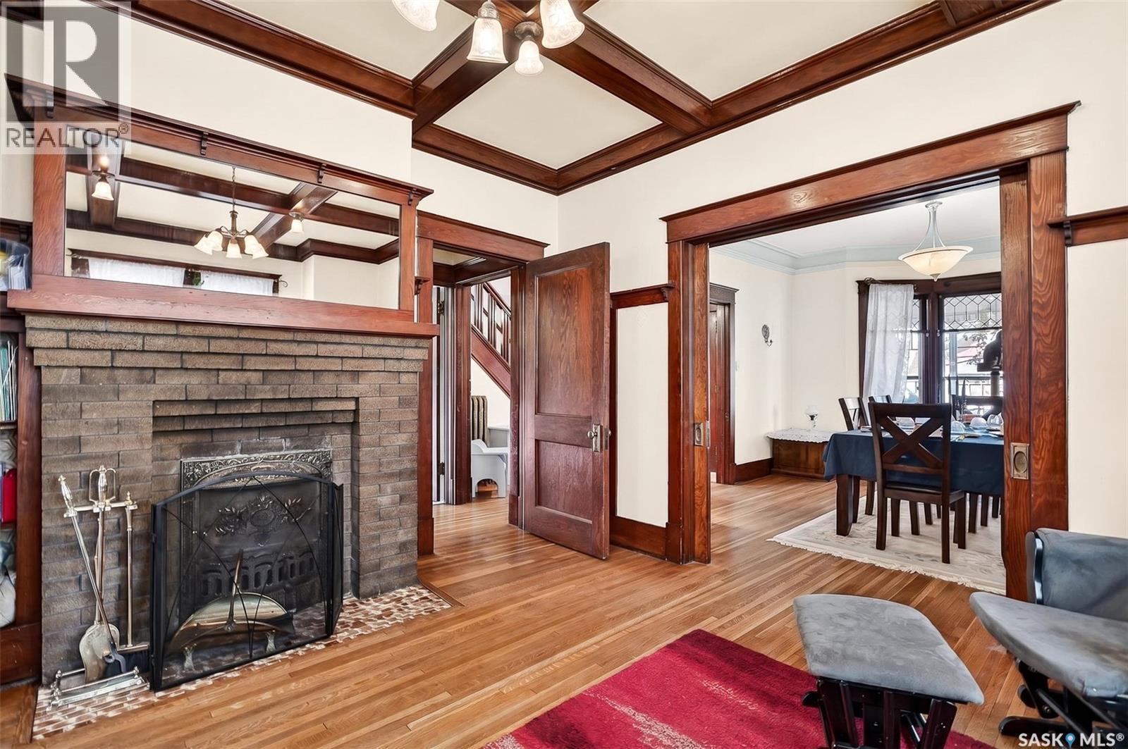 1037 Chestnut Avenue, Moose Jaw, SK - Indoor Photo Showing Living Room With Fireplace