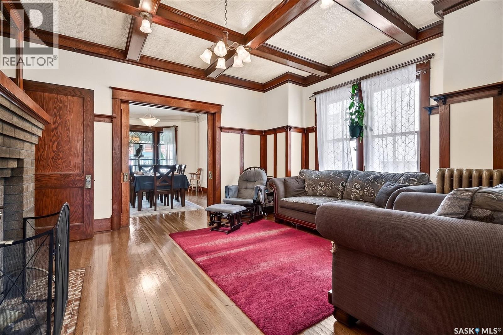 1037 Chestnut Avenue, Moose Jaw, SK - Indoor Photo Showing Living Room With Fireplace