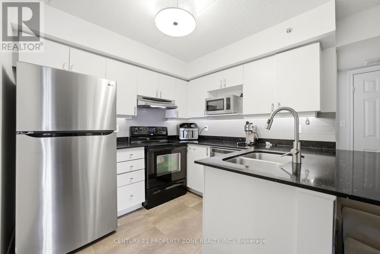 306 - 1440 Bishops Gate, Oakville, ON - Indoor Photo Showing Kitchen With Double Sink