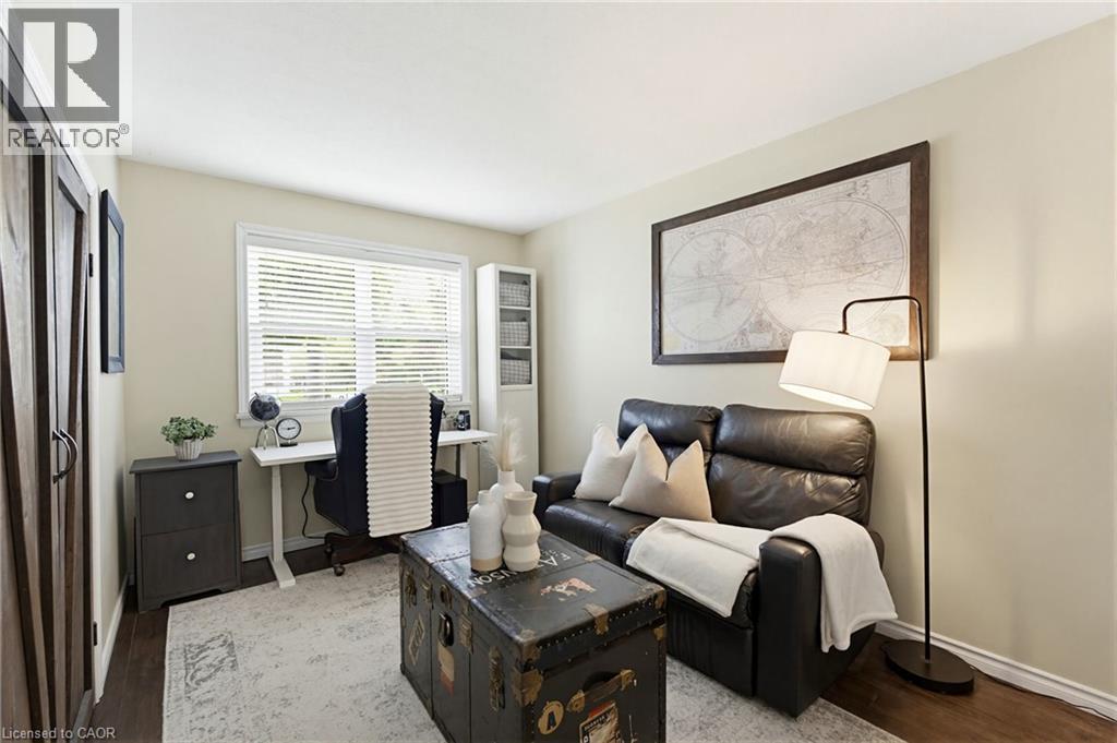 Interior room featuring wood-finish flooring and light neutral wall tones - 60 Avenue Road, Cambridge, ON - Indoor