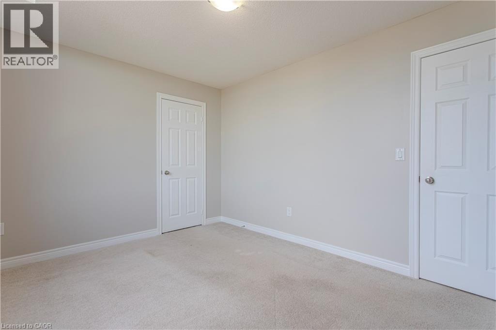 Neutral-toned wall paint throughout - 3896 Tufgar Crescent, Burlington, ON - Indoor Photo Showing Other Room