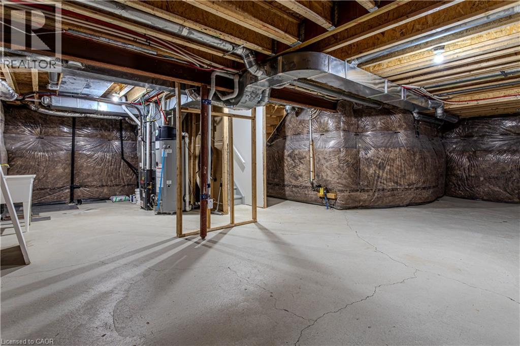 Unfinished basement with concrete flooring, exposed wood joists, and visible utility infrastructure, including ductwork and plumbing - 3896 Tufgar Crescent, Burlington, ON - Indoor Photo Showing Basement