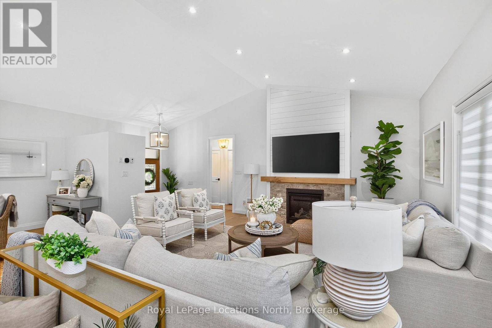 15 Pinecone Avenue, Tiny, ON - Indoor Photo Showing Living Room With Fireplace