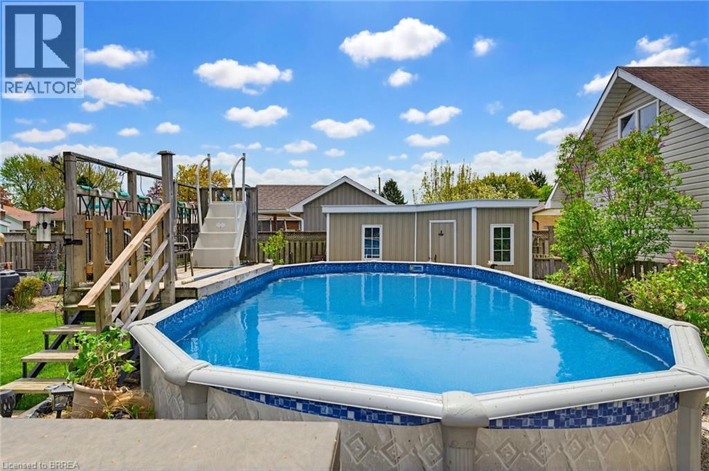12 Mccammon Street, Paris, ON - Outdoor With Above Ground Pool