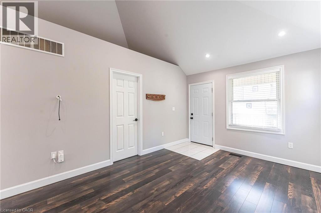 Foyer with vaulted ceiling, dark wood finished floors, and recessed lighting - 222 Kensington Avenue N, Hamilton, ON - Indoor Photo Showing Other Room