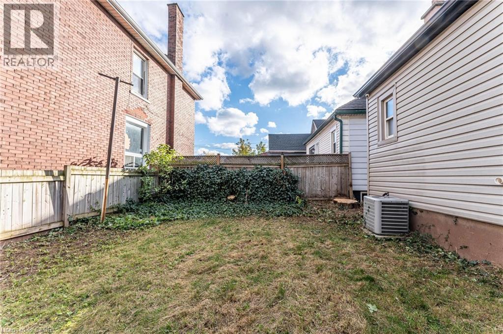 View of fenced backyard - 222 Kensington Avenue N, Hamilton, ON - Outdoor