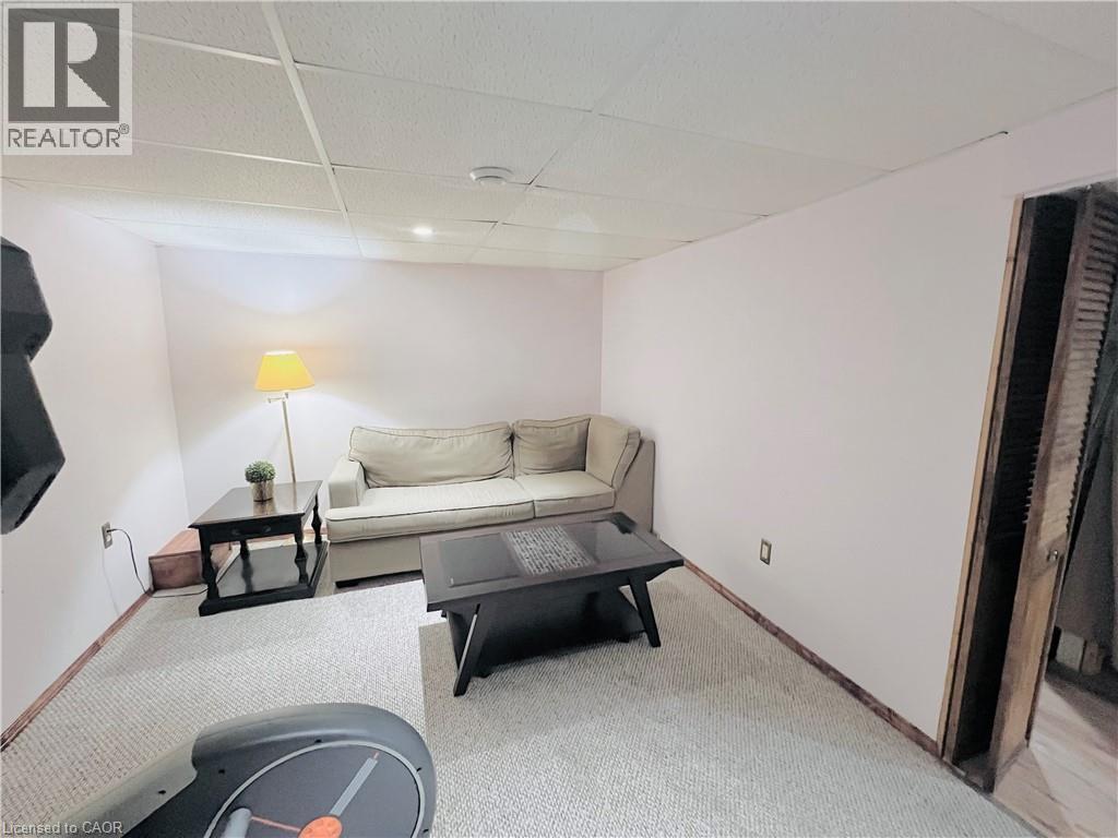 Carpeted room with drop ceiling and recessed lighting - 56 Eastvale Place, Hamilton, ON - Indoor