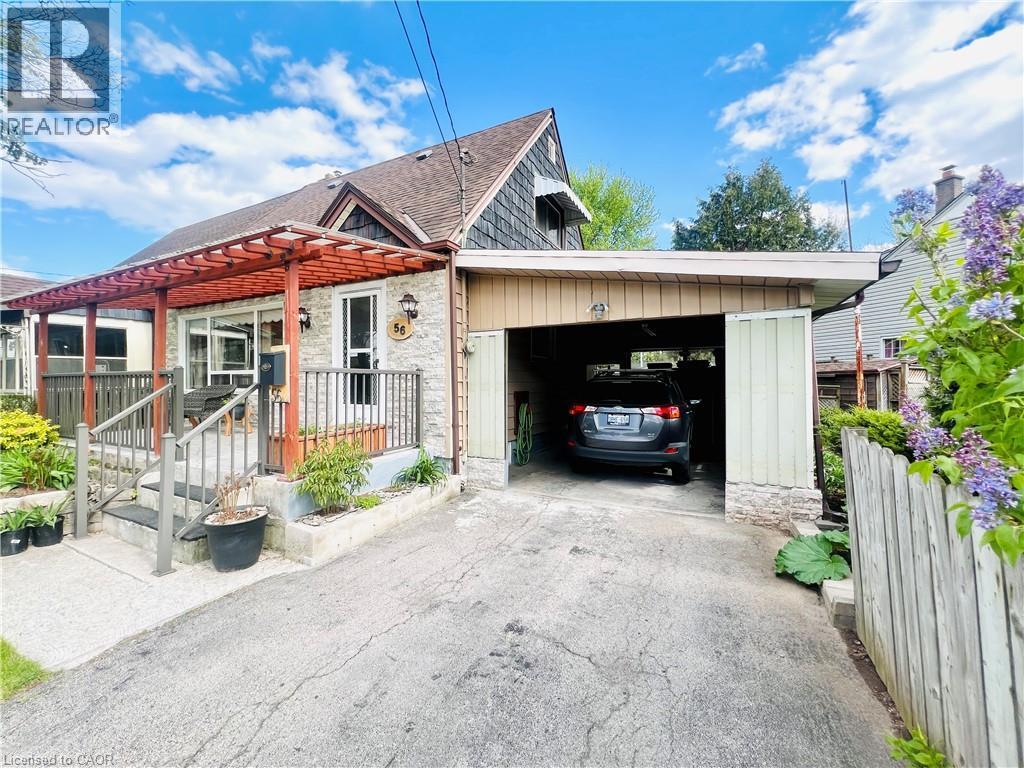Exterior featuring a stone facade, wood pergola, covered front porch, and an attached carport - 56 Eastvale Place, Hamilton, ON - Outdoor