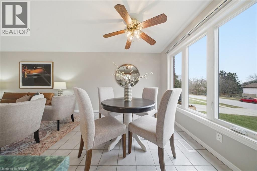 Dining room with a ceiling fan and light tile patterned flooring - 7 Forest Drive, Paris, ON - Indoor Photo Showing Dining Room