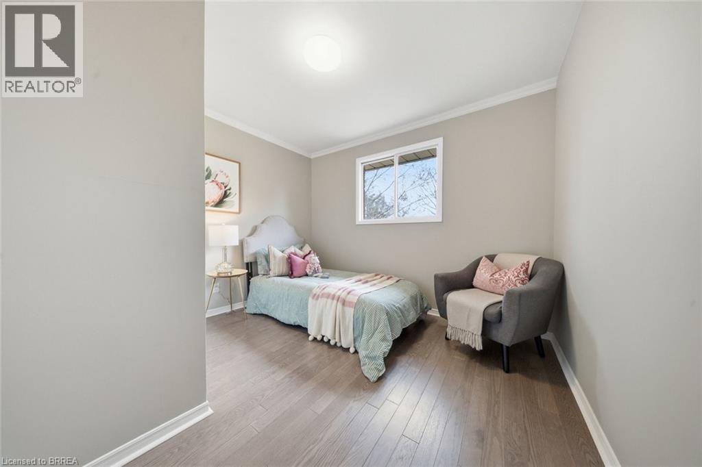 Bedroom with crown molding and wood finished floors - 7 Forest Drive, Paris, ON - Indoor Photo Showing Bedroom