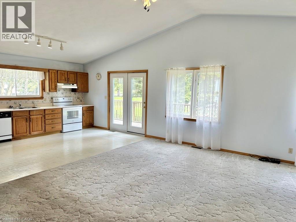 Open-concept living area featuring a vaulted ceiling - 165 Highway 6, Simcoe, ON - Indoor