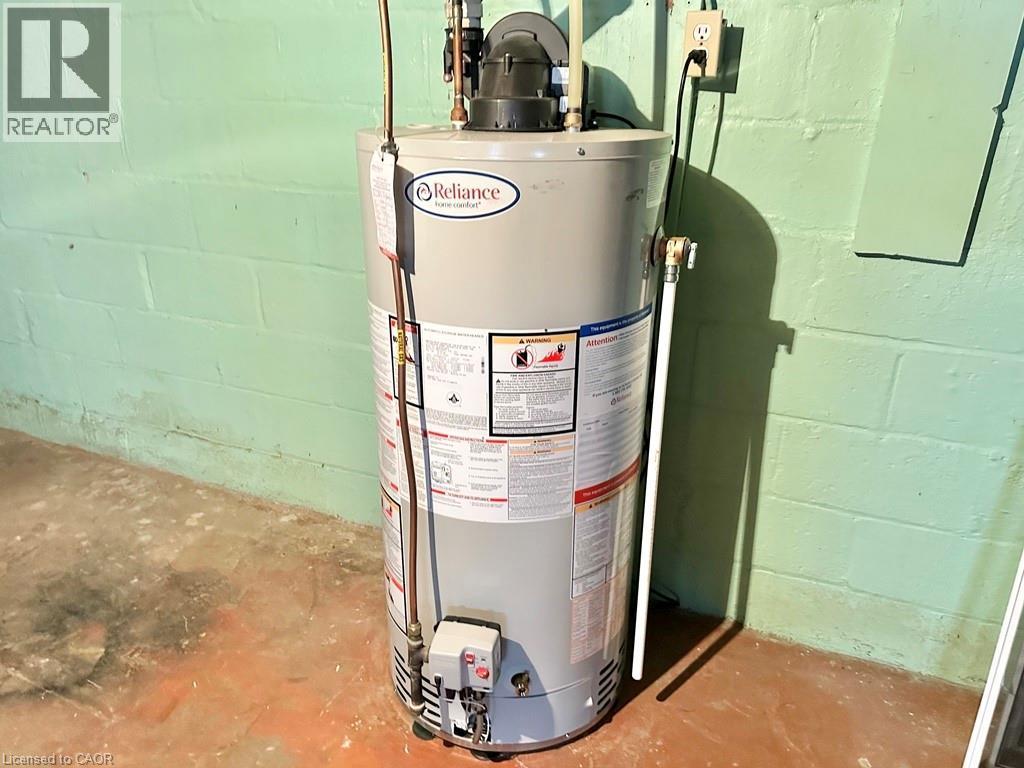 Reliance brand water heater - 165 Highway 6, Simcoe, ON - Indoor Photo Showing Basement