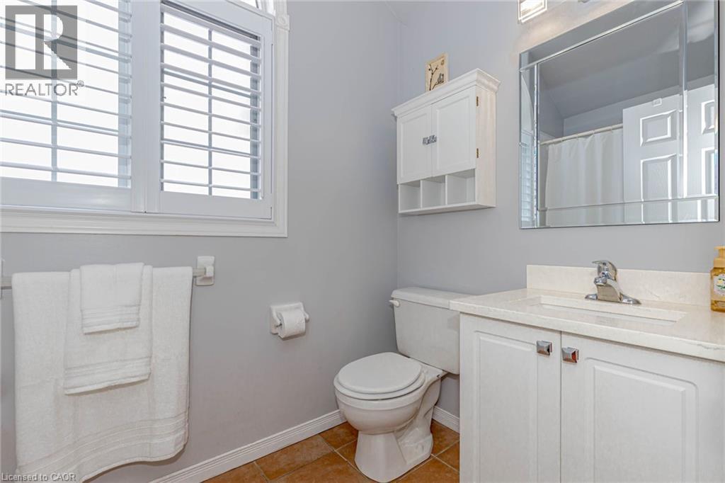 Bathroom featuring vanity, curtained shower, and light tile patterned floors - 32 Vineberg Drive, Hamilton, ON - Indoor Photo Showing Bathroom