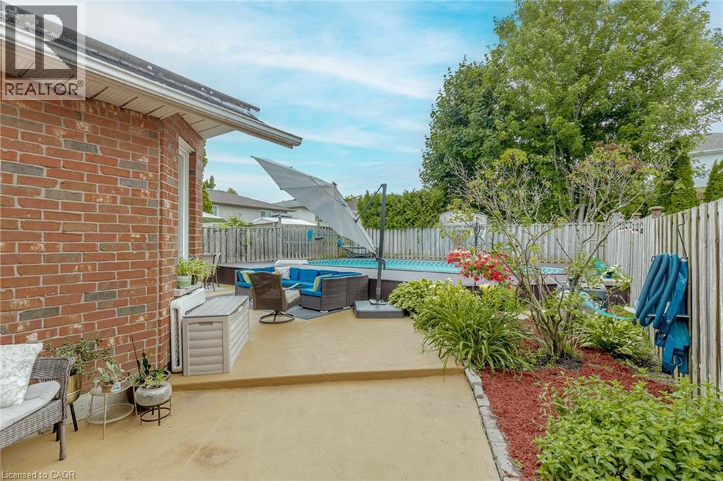 Fenced backyard featuring outdoor furniture and a patio - 32 Vineberg Drive, Hamilton, ON - Outdoor
